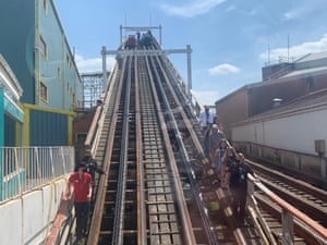 Visitors are helped down from a broken down rollercoaster ride at Blackpool Pleasure Beach
