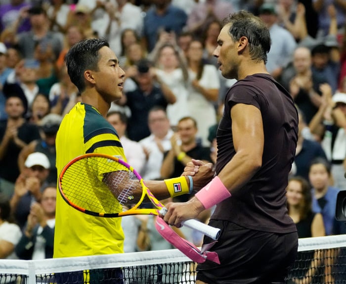 Rinky Hijikata shaking hands with Rafael Nadal after their match