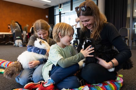 Stephanie Lambiris with her children Stella, 10, and Charlie, six, play with the new MetaCats at Springwood library