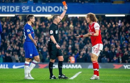 David Luiz protests as he is given a red card by referee Stuart Attwell.