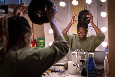 Sharon Duncan-Brewster applies a wig for her transformation into Denise, for Death of England: Closing Time at Soho Place.