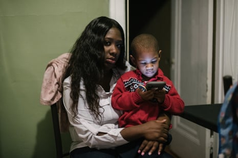 Shanaya Ball sits with her son, Amari, at her home in Philadelphia.