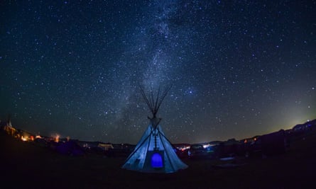 As night falls, the Milky Way begins to form directly behind a teepee at Oceti Sakowin prayer camp, September 7th, 2016.