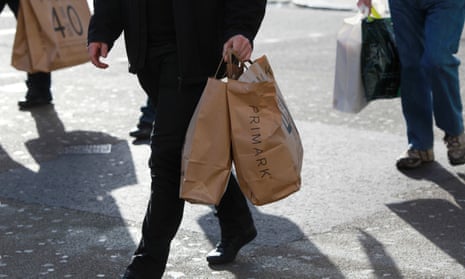 Male shopper with Primark bags