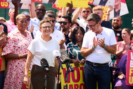 Bev Craig and Andy Burnham in front of a crowd of Labour supporters