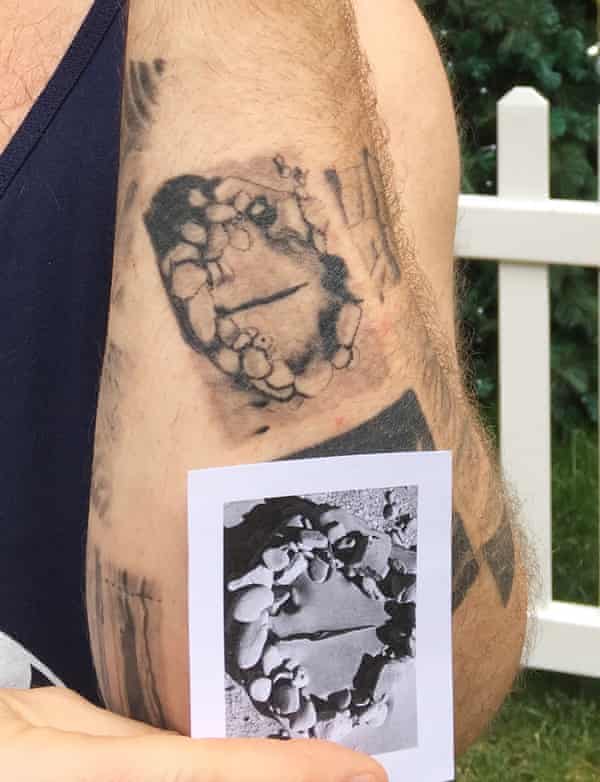 Ian Andrews takes close-up photos of the shoreline at Castlepoint and has some of his favorites tattooed on his arm.