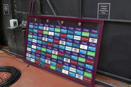 A Premier League backdrop for TV interviews in a storage area.