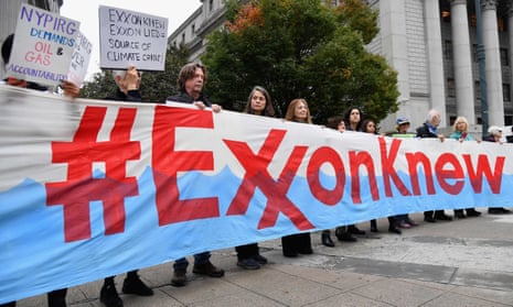 Climate activists protest during ExxonMobil’s trial, outside the New York state supreme court building in New York City in October.