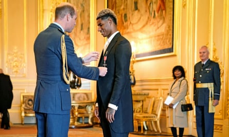 Footballer Marcus Rashford being made an MBE (Member of the Order of the British Empire) by the Duke of Cambridge during an investiture ceremony at Windsor Castle on Tuesday 21 December 21, 2021.