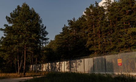 A section of Poland’s border wall with Belarus, reinforced with barbed wire at the top and bottom.