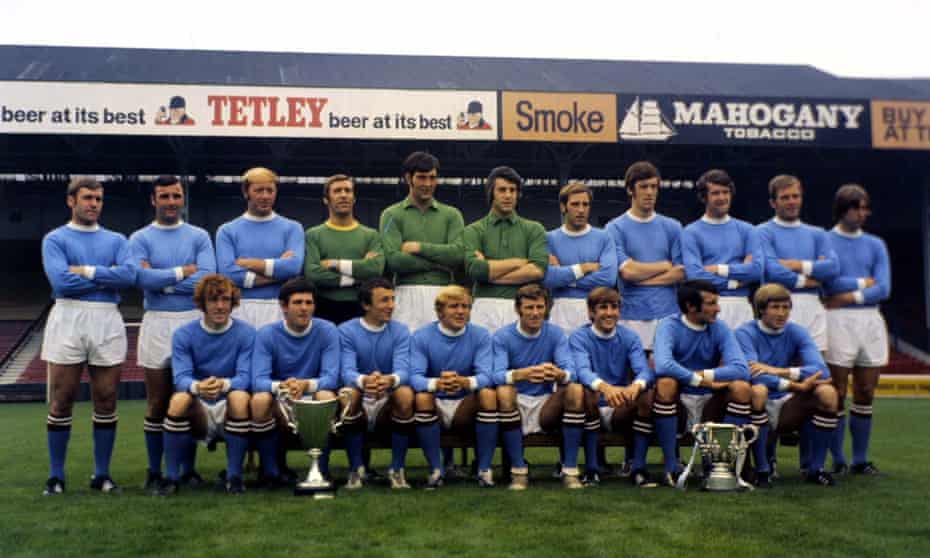 Manchester City players show off their 1970 trophy haul of the European Cup Winners’ Cup and the League Cup at Maine Road before the 1970-71 season.