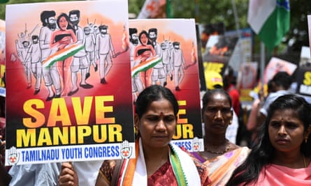 Activists of the Tamil Nadu Youth Congress take part in a demonstration against ethnic violence in Manipur, in Chennai on 21 July. They are holding banners saying Save Manipur and depicting angry men holding a woman captive