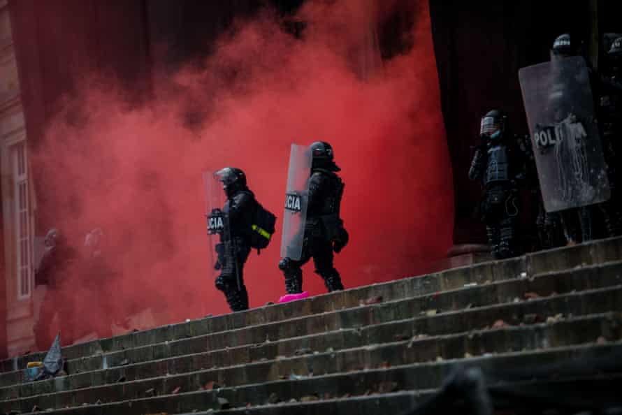Riot police officers in Bogotá, Colombia, on 5 May.