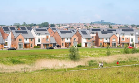 A modern housing estate of detached houses with solar panels in England