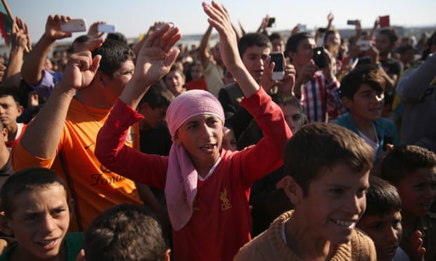 Yazidi refugees in Syria celebrate the recapture of Sinjar in Iraq