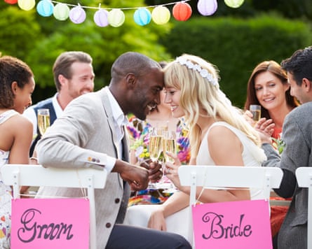 Bride And Groom Enjoying Meal At Wedding Reception