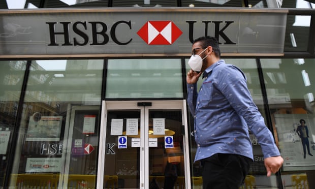 A pedestrian passes a HSBC bank branch in central London