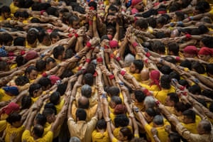 Reaching out: the outstretched arms of members of the Castellers de Villnova.