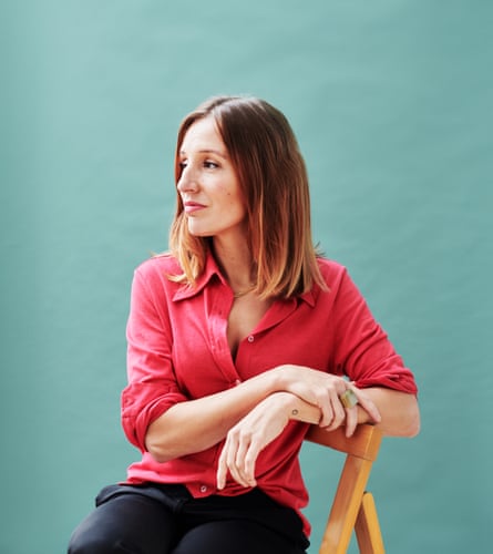 Morwenna Ferrier sitting on a chair and looking off to the side