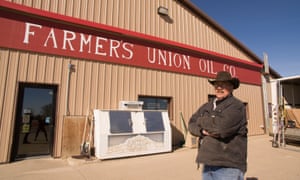 Perkins County commissioner Rusty Foster stands outside a gas station in the town of Faith, South Dakota.