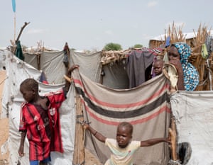 Two young boys play in a refugee camp in Dar es Salaam.