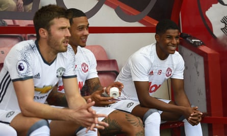 Marcus Rashford, right, on the Manchester United substitutes’ bench with Michael Carrick and Memphis Depay during their Premier League opener against Bournemouth.