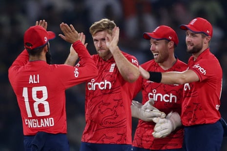David Willey celebrates with teammates after taking the wicket of Iftikhar.