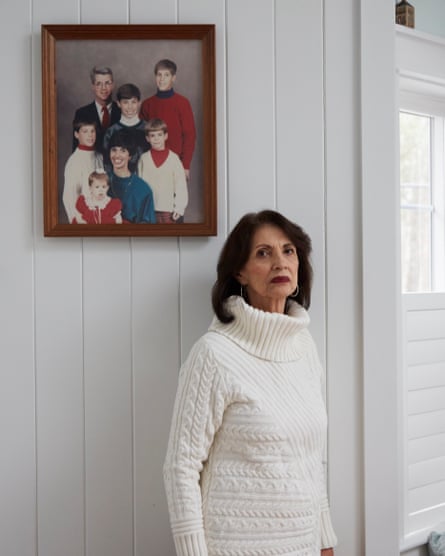 Diane Foley in front of a family portrait. James is on the top right of the image.