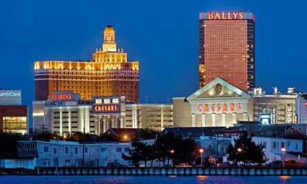 At night, casinos illuminated on the Atlantic City boardwalk