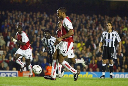 The Arsenal striker Thierry Henry chips a penalty towards goal against Newcastle.
