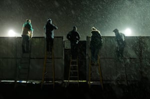 Canvey supporters watching on ladders overlooking the away end.