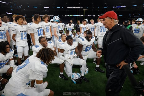NFL Academy head coach Steve Hagen talks to his players straight after the 31-9 defeat to De La Salle Spartans from California.
