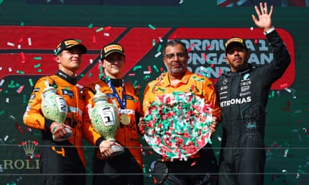 Lewis Hamilton (right) joins Oscar Piastri and Lando Norris on the podium