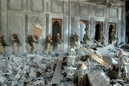 US army soldiers from A Company, 3rd Battalion, 7th Infantry Regiment search a presidential palace in Baghdad, 8 April 2003.