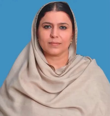 A woman wearing a beige dupatta.