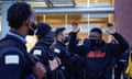 An activist holds his hands up outside Chicago police headquarters during a rally on 15 April. 