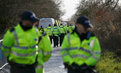 Police arrive to begin the eviction of anti-fracking protesters from an IGas test drilling site near Upton