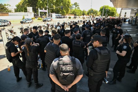 Dozens of police officers standing in uniform