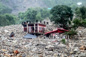 A residential building is destroyed by rocks