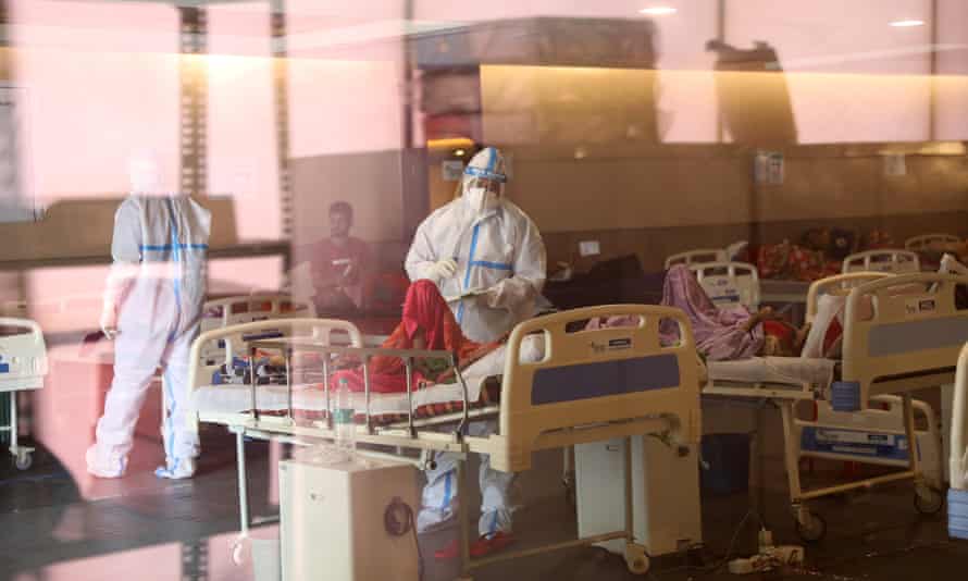 Indian doctors examine patients in a Covid care centre in Delhi, April 2021. 
