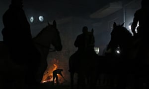 The bonfires being made as the riders and horses wait to take part