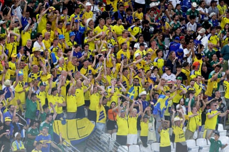 The yellow wall of Sweden fans go wild in the stands.