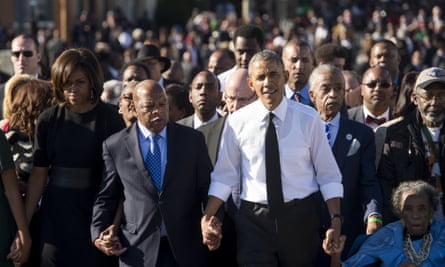 Barack Obama walks alongside Lewis across the Edmund Pettus Bridge in 2015 to mark the 50th anniversary of the Selma to Montgomery marches in Selma, Alabama.