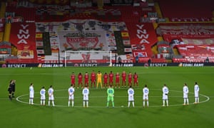 The players and officials observe a minute’s silence for Diego Maradona.