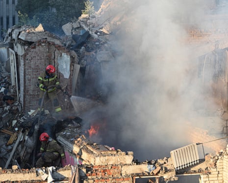 First responders operate at a residential building partially destroyed as a result of Russian missile strikes in the western Ukrainian city of Lviv.