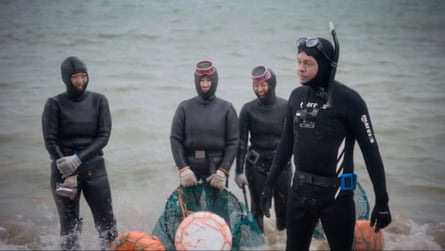 Mulhern overcomes his fear of swimming in open water with the help of professional divers.