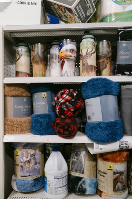 blankets and a bleach bottle on a shelf