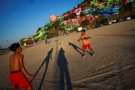 Two boys playing football