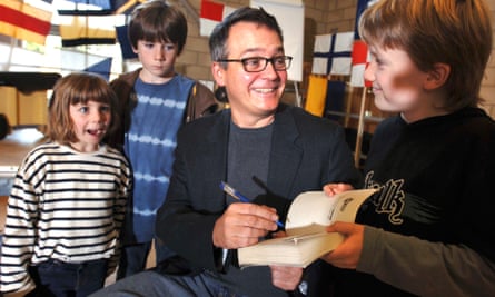 Charlie Higson signs a Young Bond book.