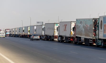 A convoy of aid trucks on the Egyptian side of the crossing